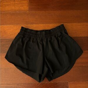 Lululemon 2.5” frilly hem shorts. Size: 4. Color: Black